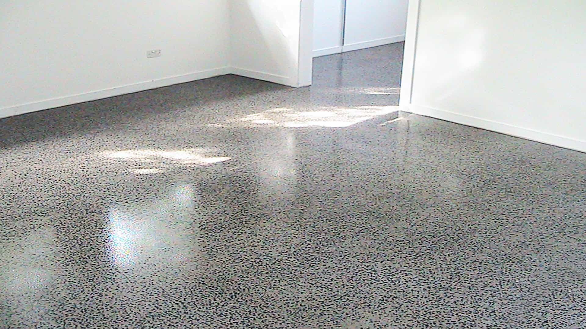 Specialist completing concrete coatings and polishing on a Bergen County - NJ floor with grinding equipment