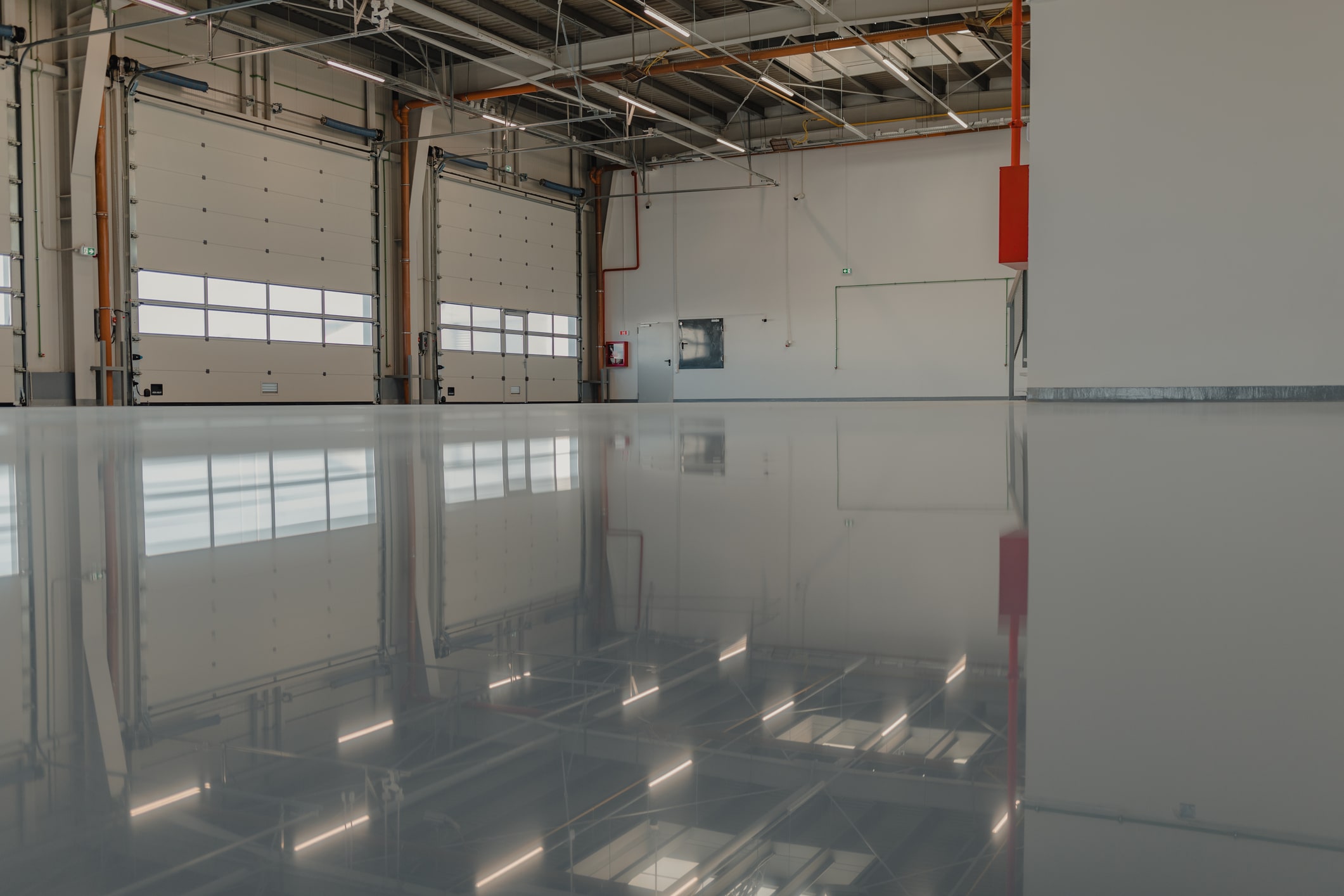 Specialist completing concrete coatings and polishing on a Bergen County - NJ floor with grinding equipment